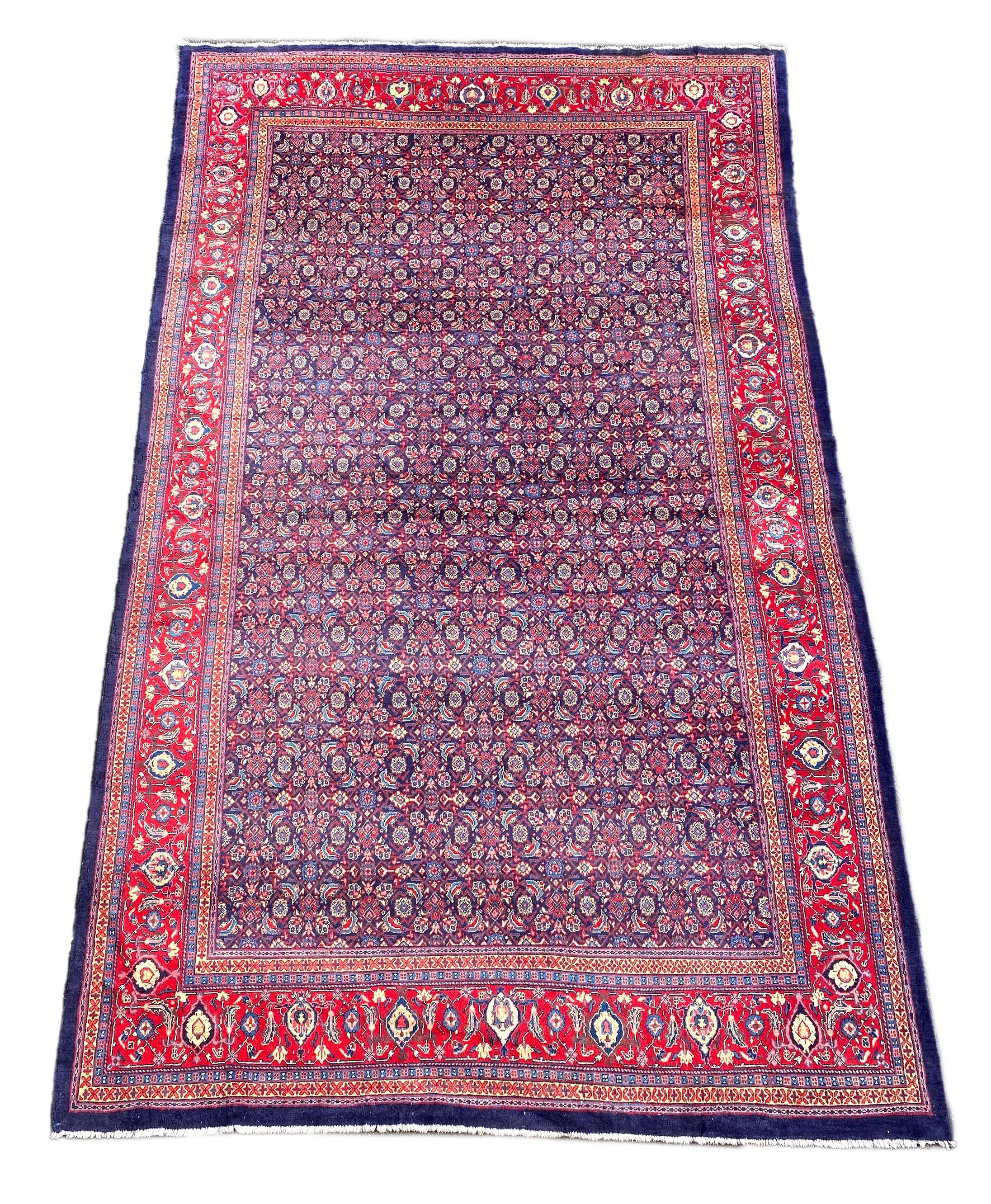 A North West Persian blue ground carpet, 534 x 325cm